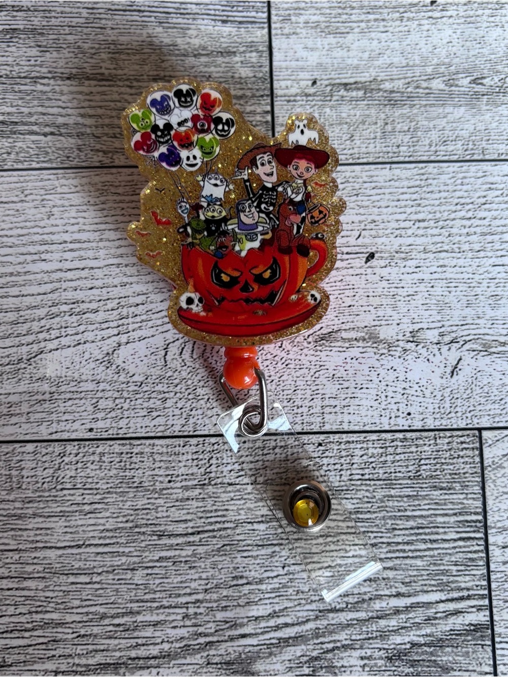 Disney Halloween Toy Story Pumpkin Badge Reel - Orange, Gold, Red, Black